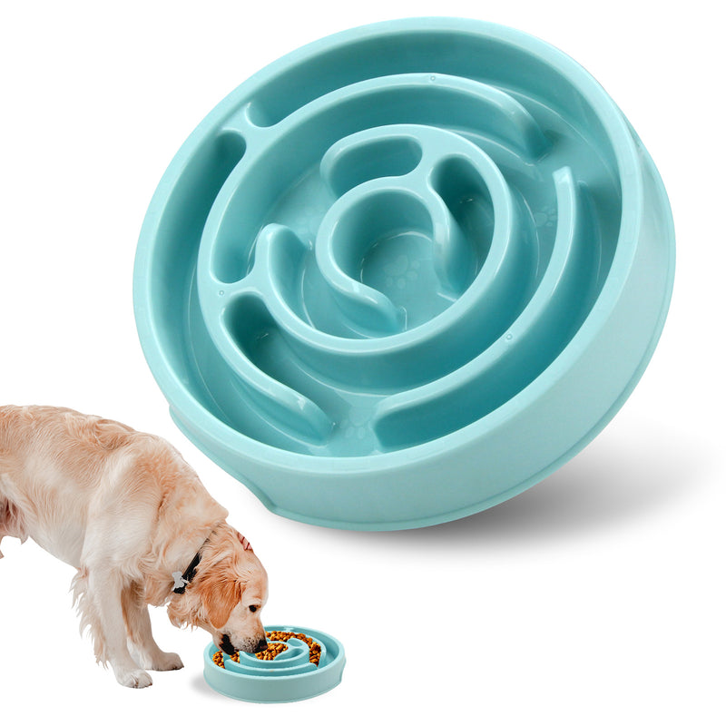 The teal slow feeder bowl seen from above, its moulded spiral ridges visible, with an inset photograph of a dog eating from it.